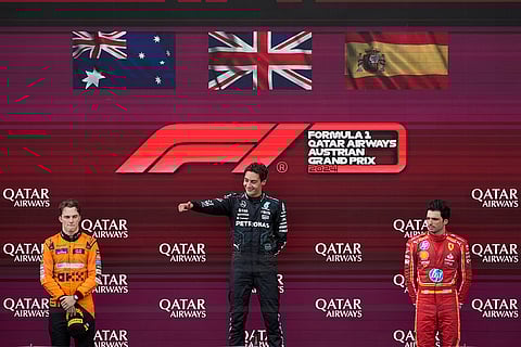 George Russell of Britain, Oscar Piastri of Australia and Carlos Sainz of Spain